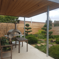 Cedar slats in a japanese garden and on the roof of a gazebo