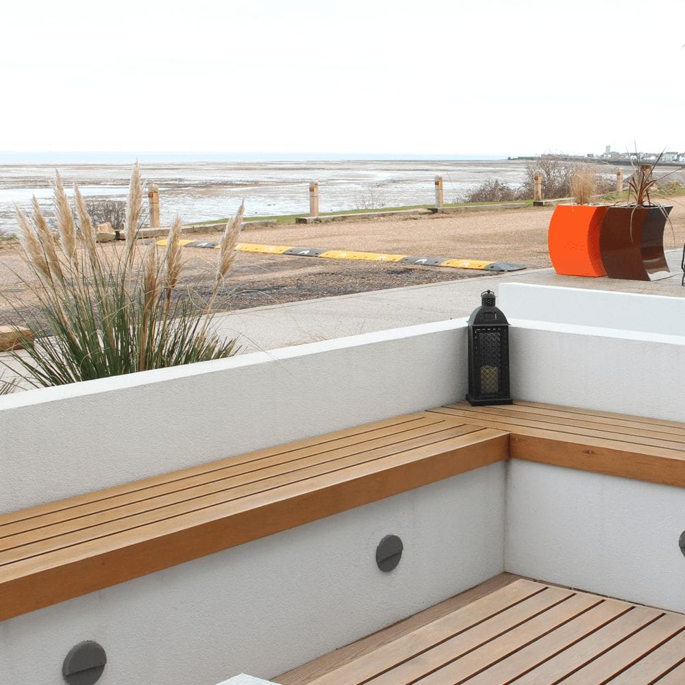 A minimalist bench near the beach. In this example the bench is placed on a surface rather than hovering with seat brackets.