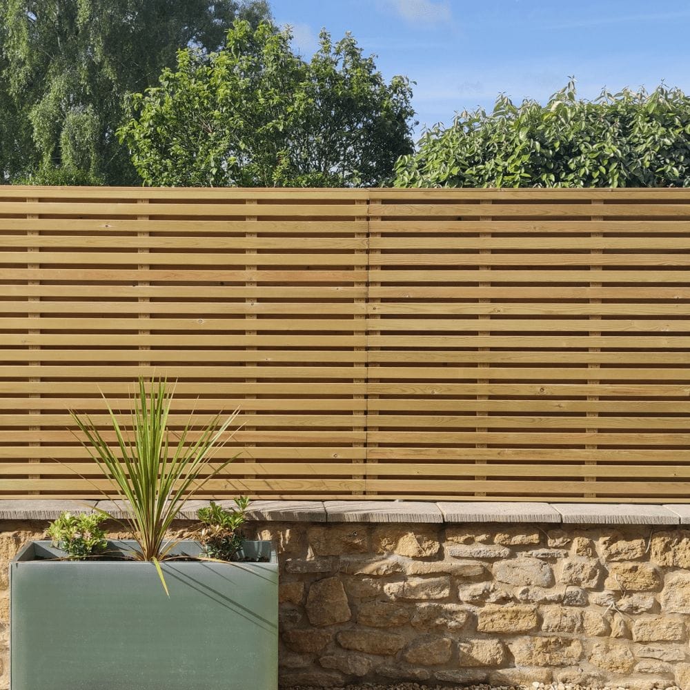 Landscaping battens are used to created this slatted fence panel.