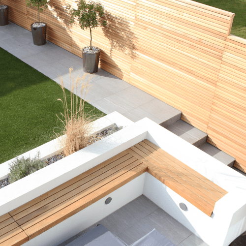 A minimalist 21st century bench seat top design for back gardens. Made out of Canadian Red Cedar. By Contemporary Fencing.